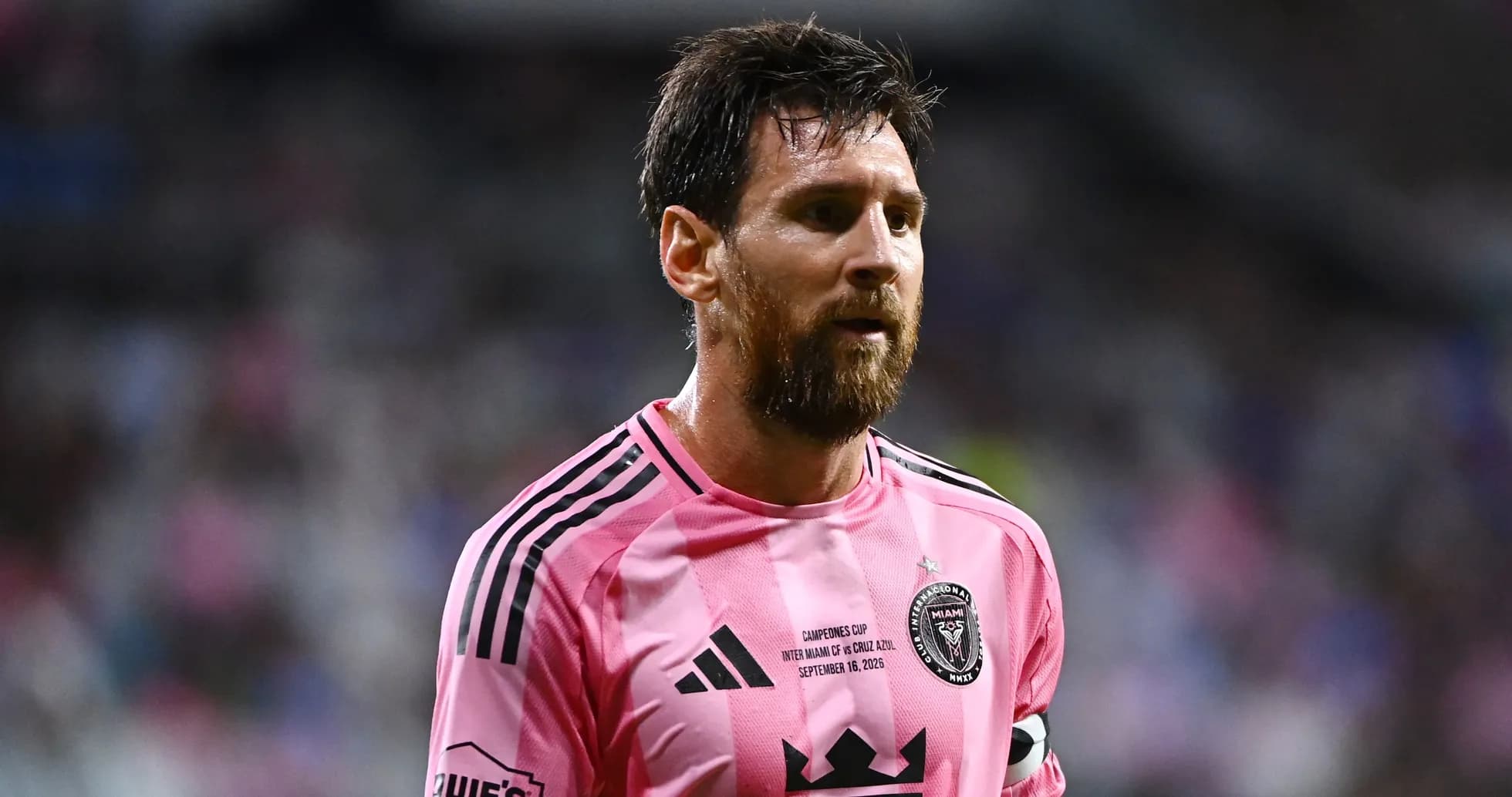 Lionel Messi in pink jersey during match