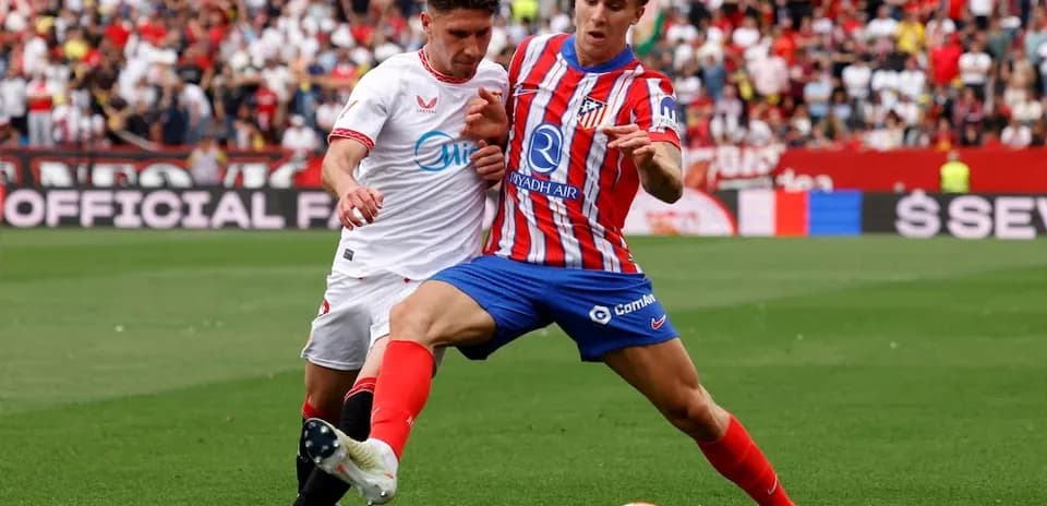 Sevilla and Atletico Madrid players in action