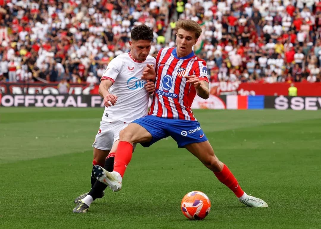 Sevilla and Atletico Madrid players in action