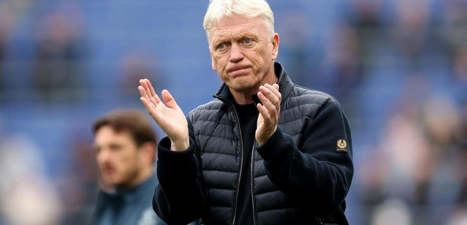 Manager applauding during match warm-up on field