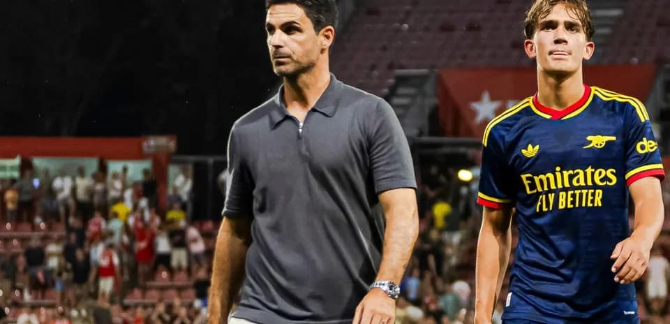 Manager and player walking off the field after match