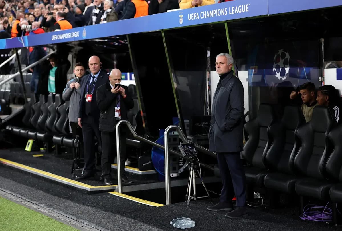 Manager observing from the bench during UEFA Champions League match