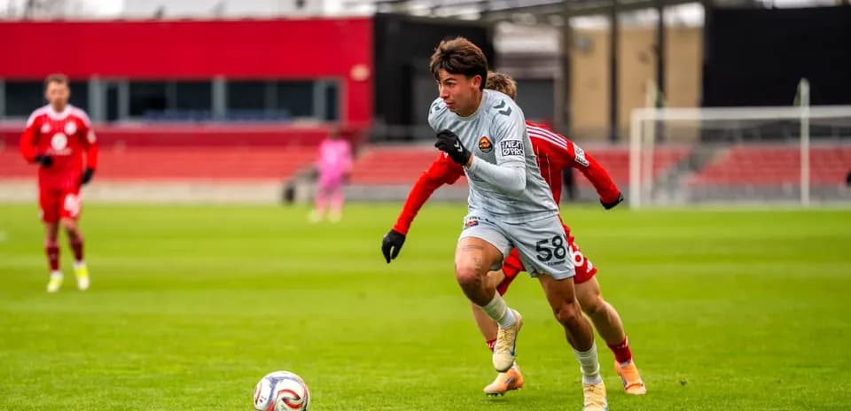 Player running with ball during Chicago Fire II match