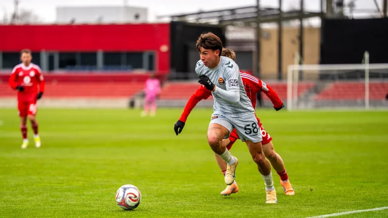 Player running with ball during Chicago Fire II match