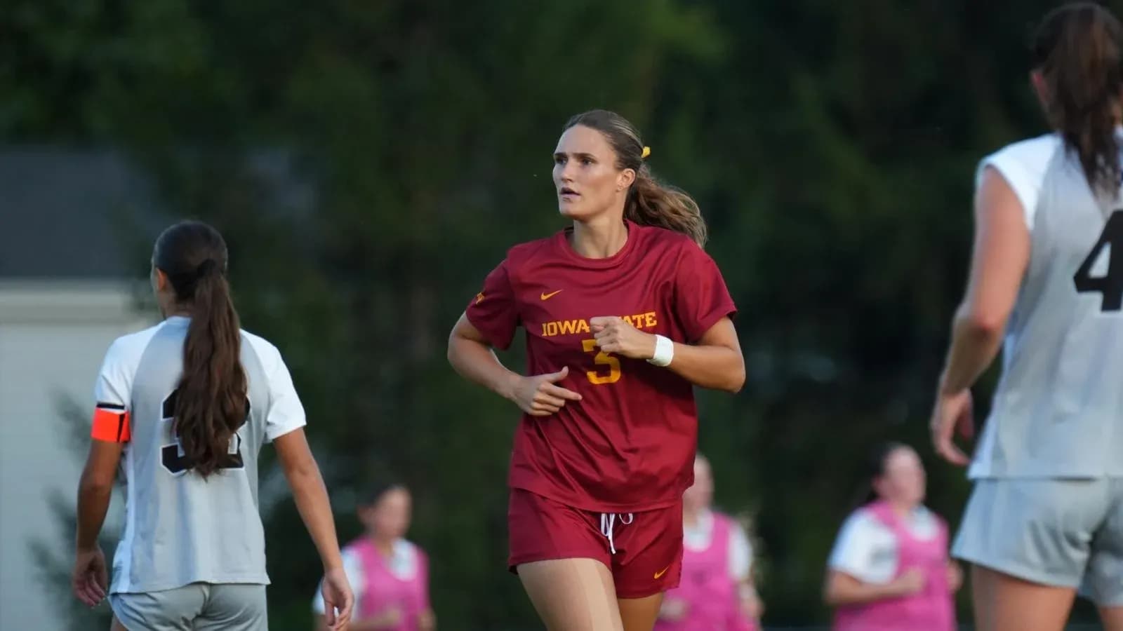 Iowa State player running on the field during match