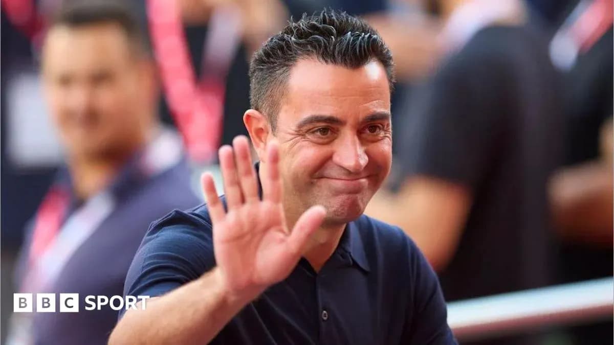 Coach waving while smiling at an event