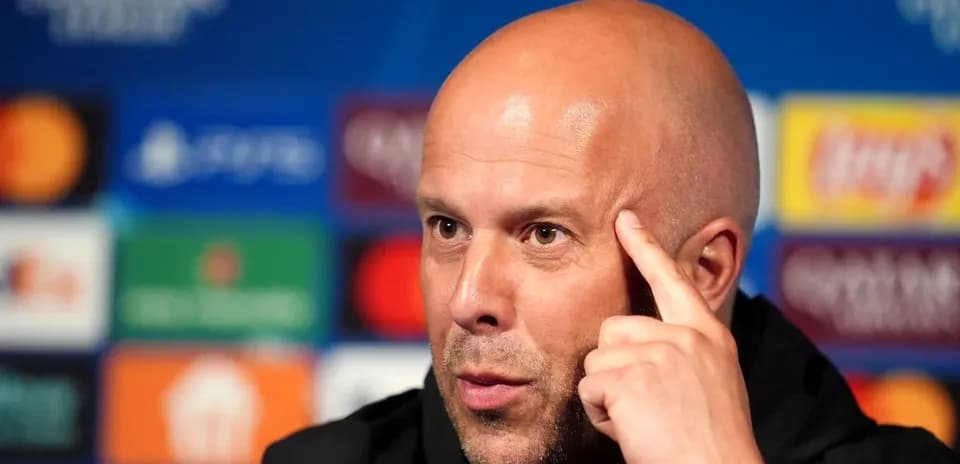 Manager speaking at press conference with UEFA logos