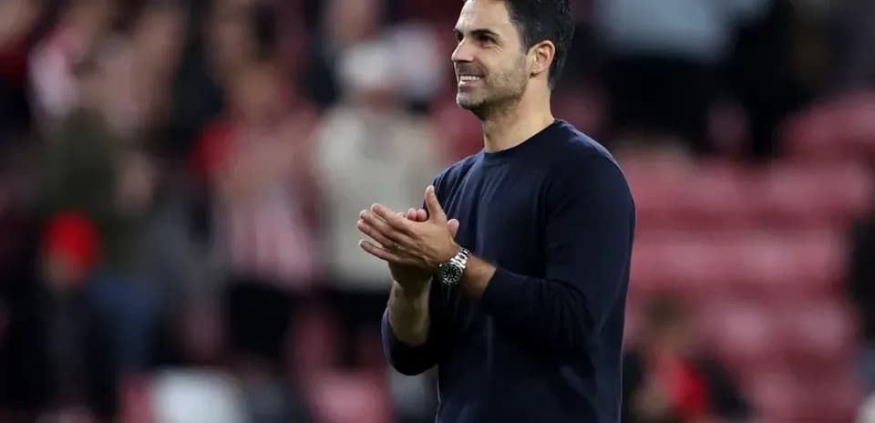 Manager applauding fans after the match