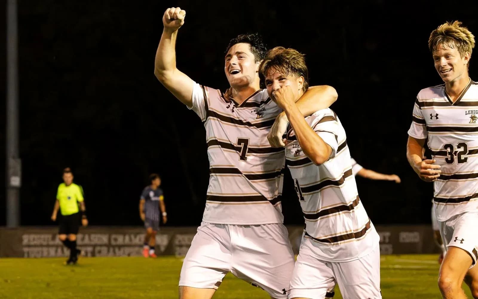Players celebrating a goal during soccer match