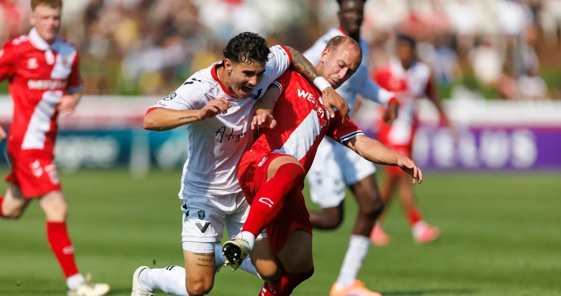 Cavalry FC player tackling Vancouver FC opponent