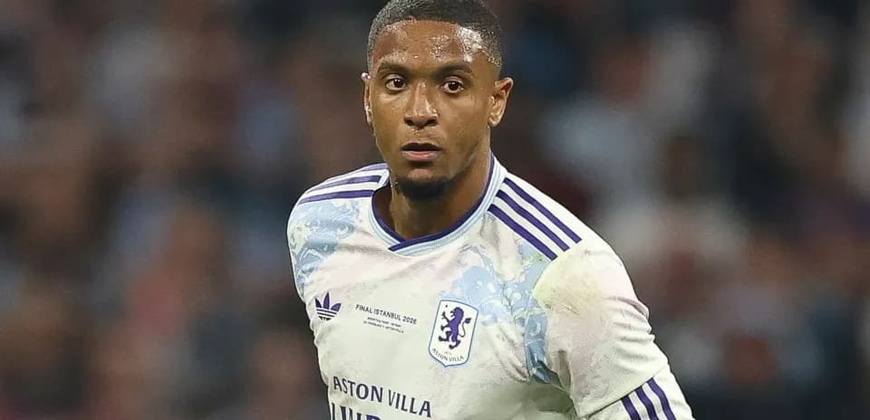 Player in Aston Villa kit running during match