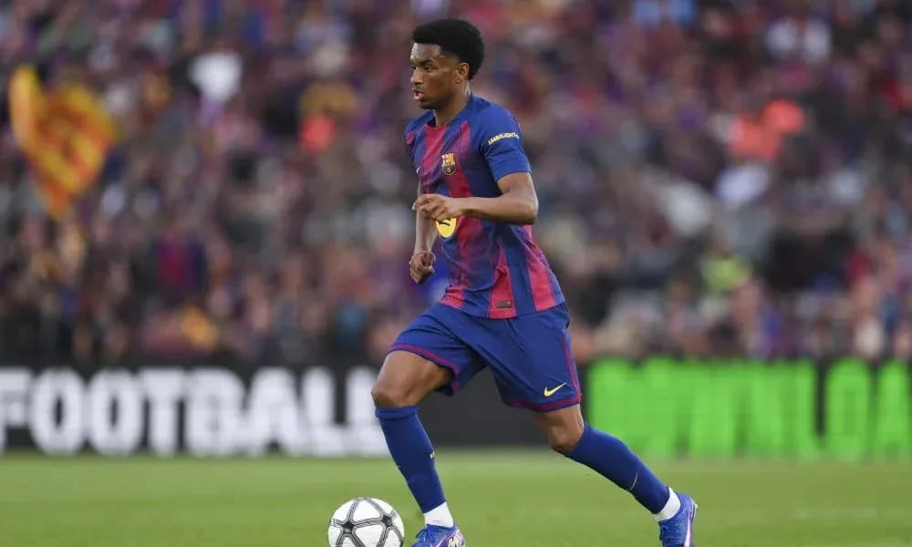Barcelona player dribbling the ball on pitch