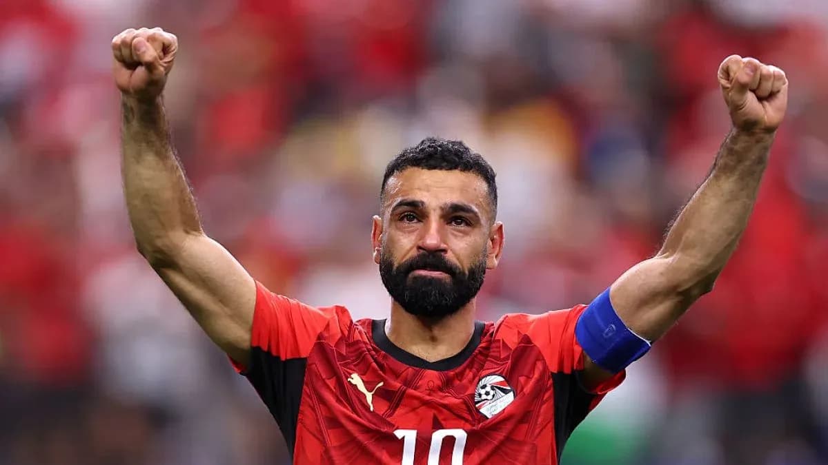 Player celebrating with raised arms after match