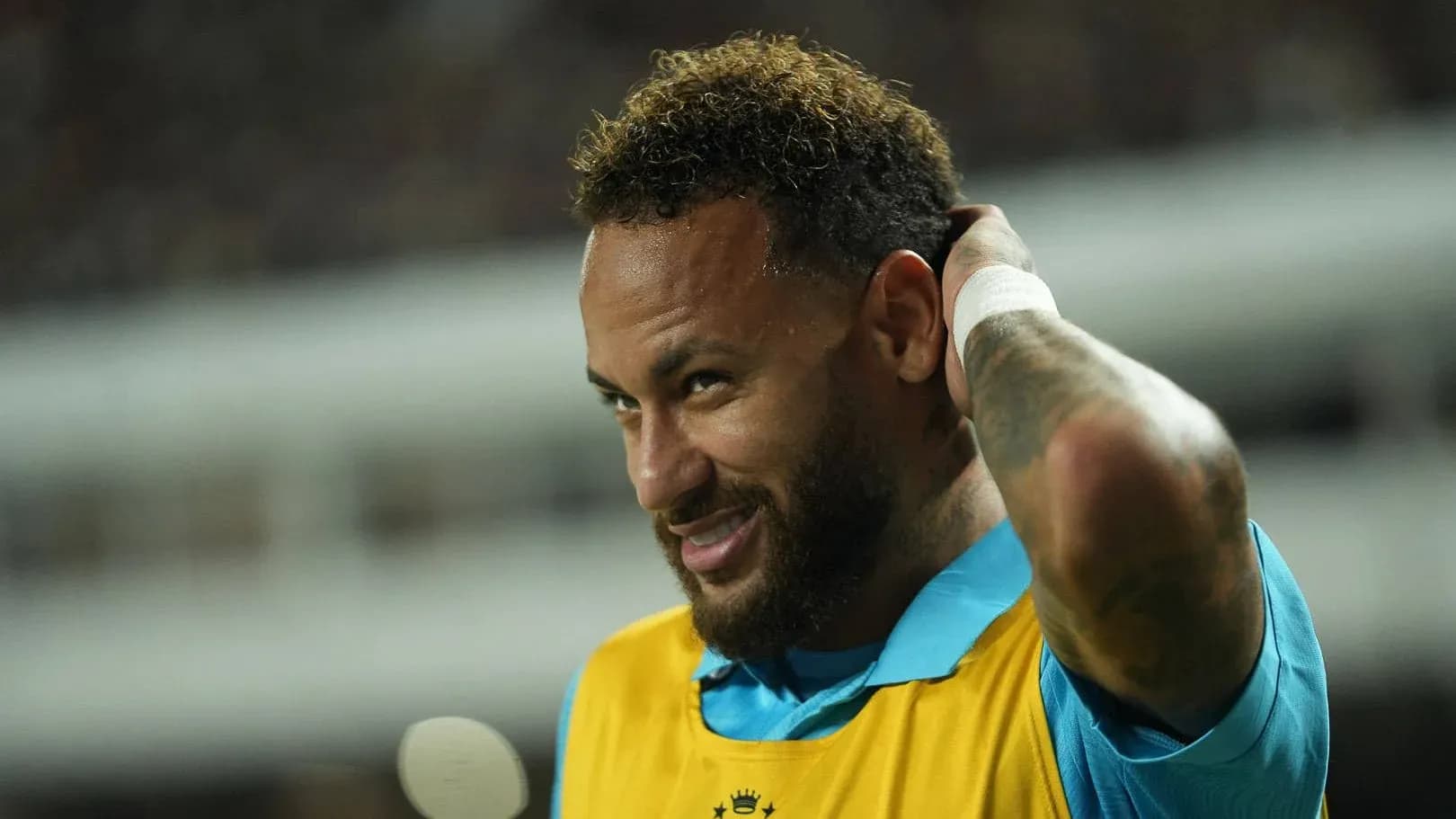 Neymar adjusting his hair during warm-up session