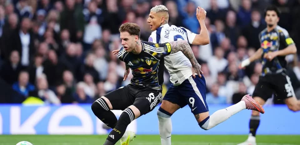 Leeds player challenged by Tottenham forward