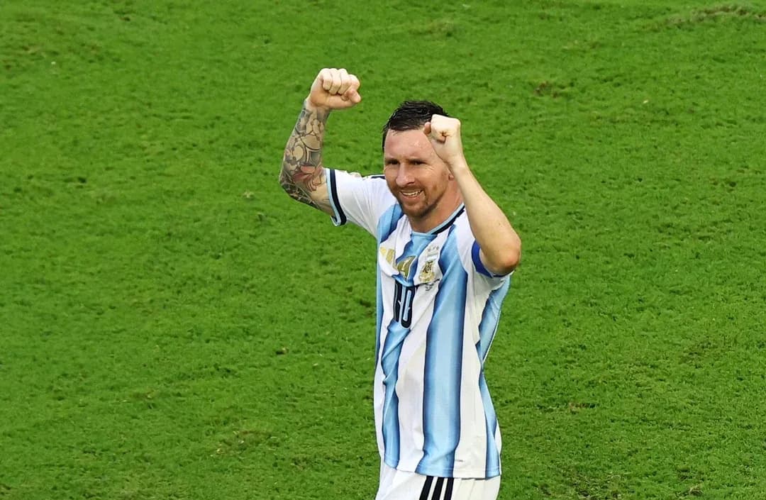 Player celebrating on the field with raised fists