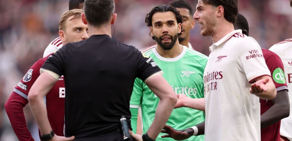 Players and referee discussing during a match