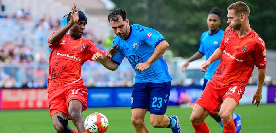 Players contesting for the ball during match