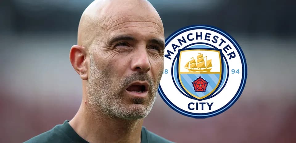Coach with Manchester City logo in background