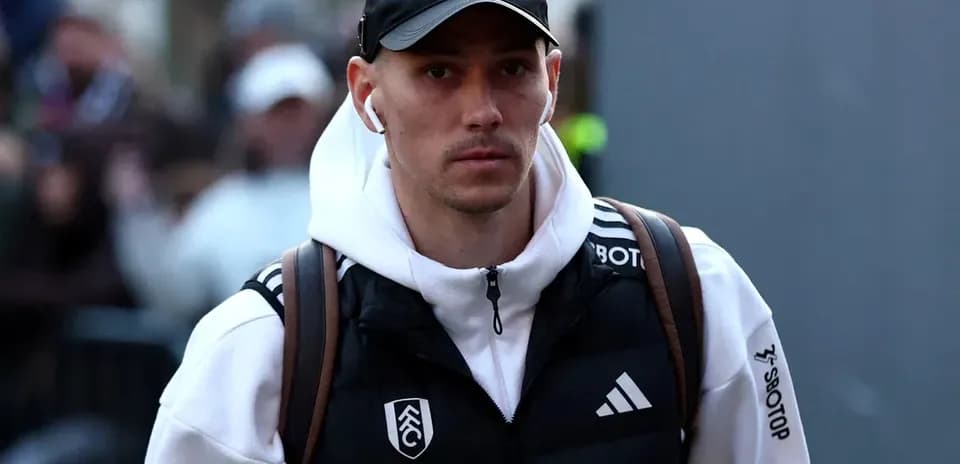Player arriving at stadium wearing team apparel