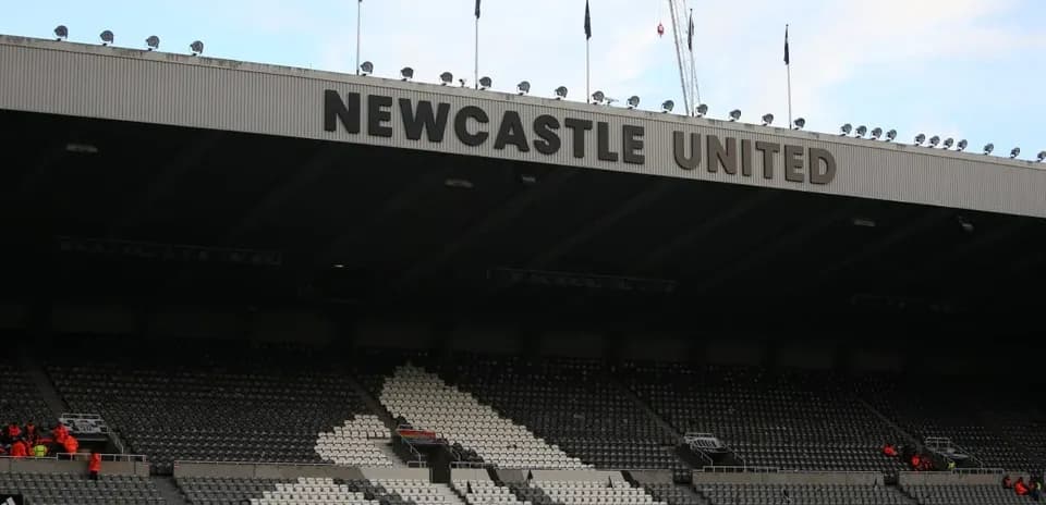 Stadium exterior with Newcastle United signage visible
