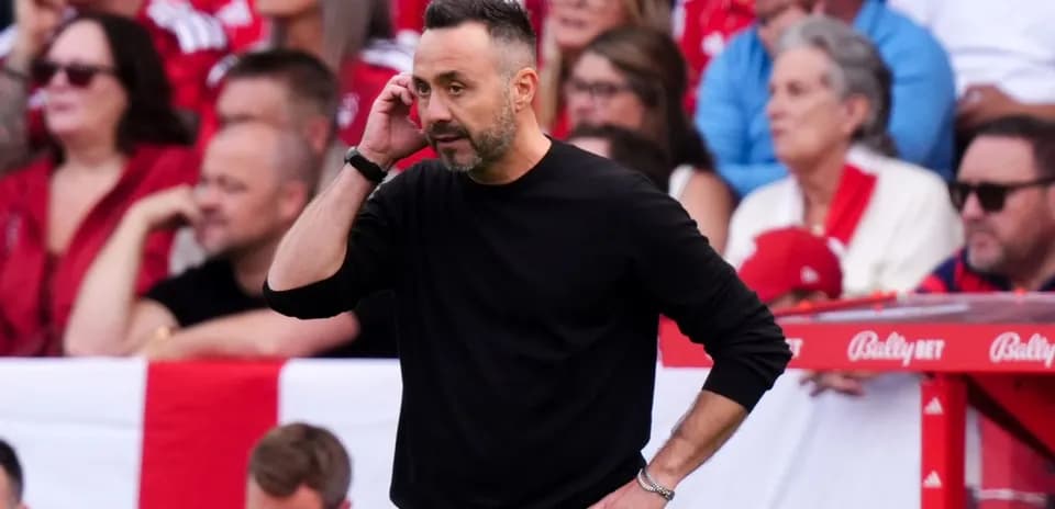 Coach speaking on the sidelines during a match