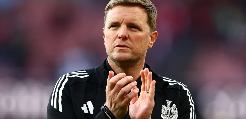 Manager clapping during a match at the stadium