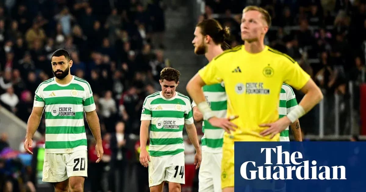 Celtic players walking off after a match defeat