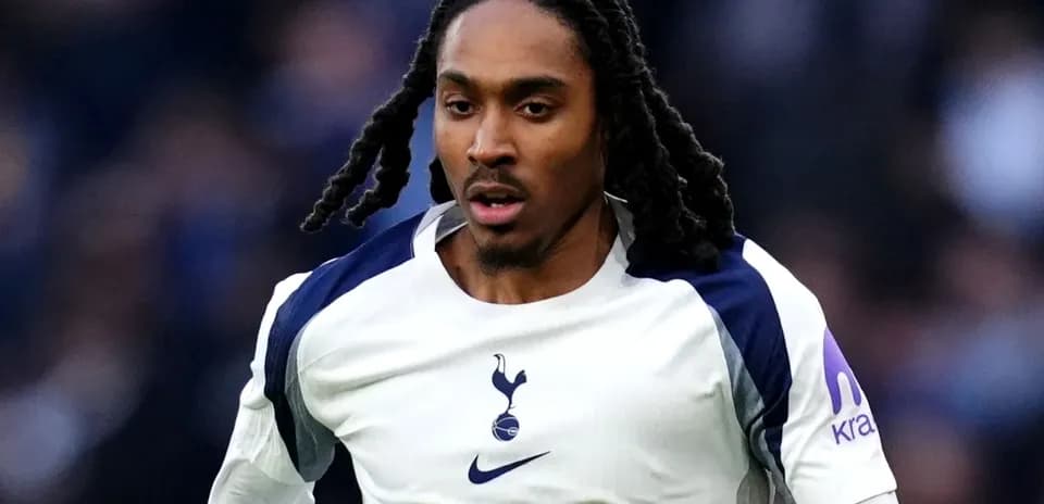 Player in Tottenham kit running on the pitch