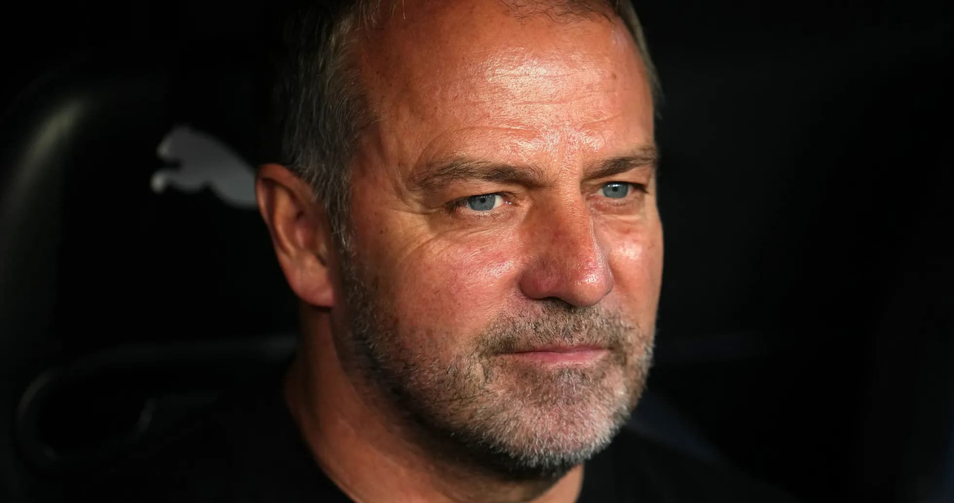 Close-up of a coach sitting on the bench