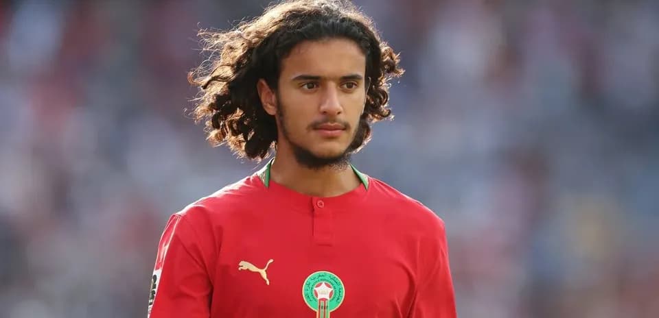 Player in red Morocco kit during match warm-up