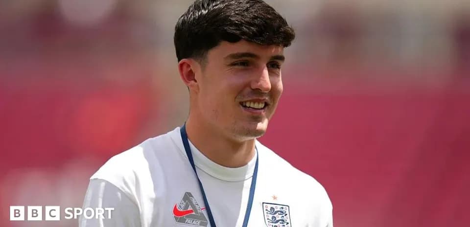 Player in England kit smiling during warm-up