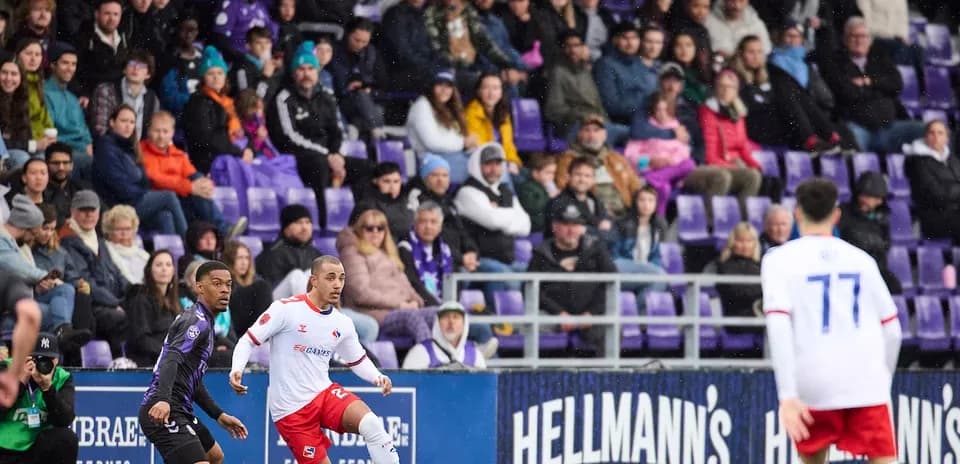 Vancouver FC player dribbling the ball during match