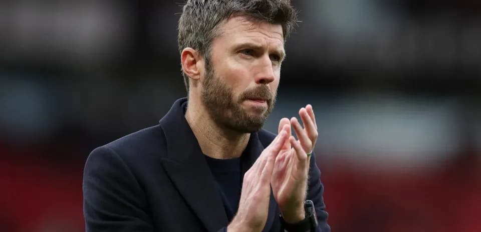Coach clapping hands on the sidelines during match