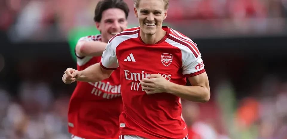 Arsenal players celebrating a goal during match