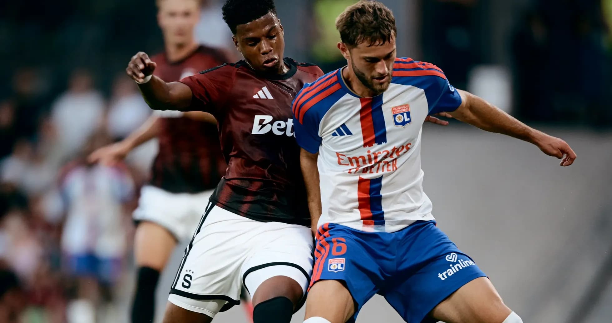 Players from Lyon and Sparta Praha battling for ball