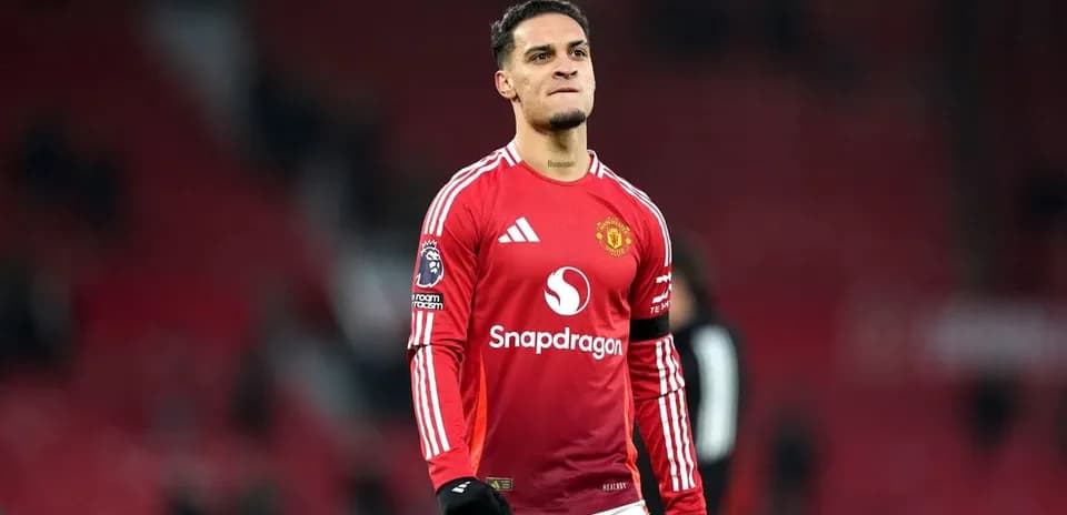 Player celebrating after match in Manchester United kit