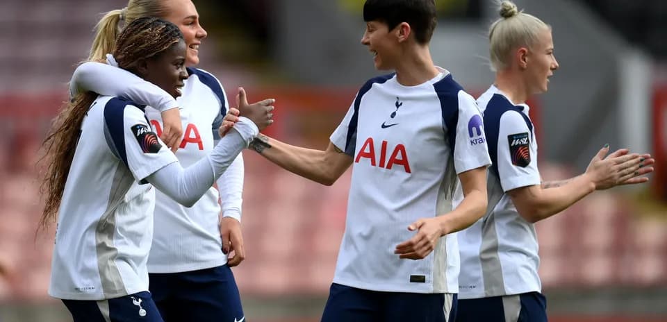 Tottenham players celebrating a goal during match