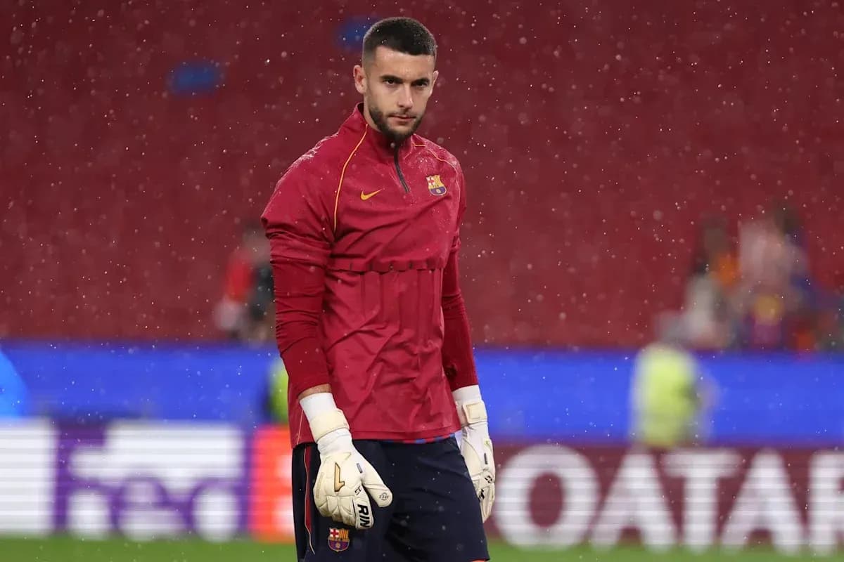 Goalkeeper warming up in rain before match