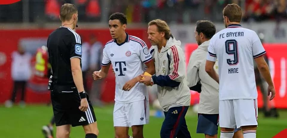 Bayern Munich player interacting with referee during match