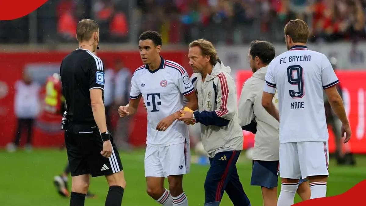 Bayern Munich player interacting with referee during match