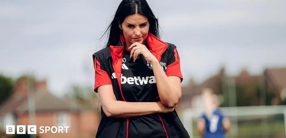 Coach observing training session with crossed arms