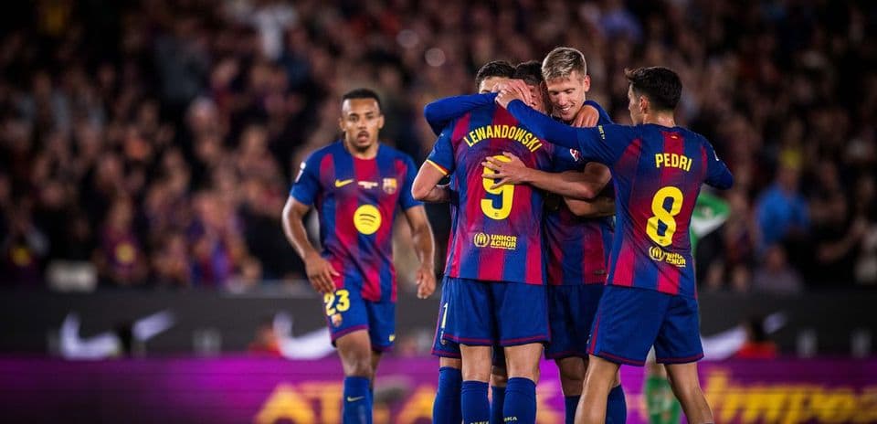 Barcelona players celebrating a goal during match