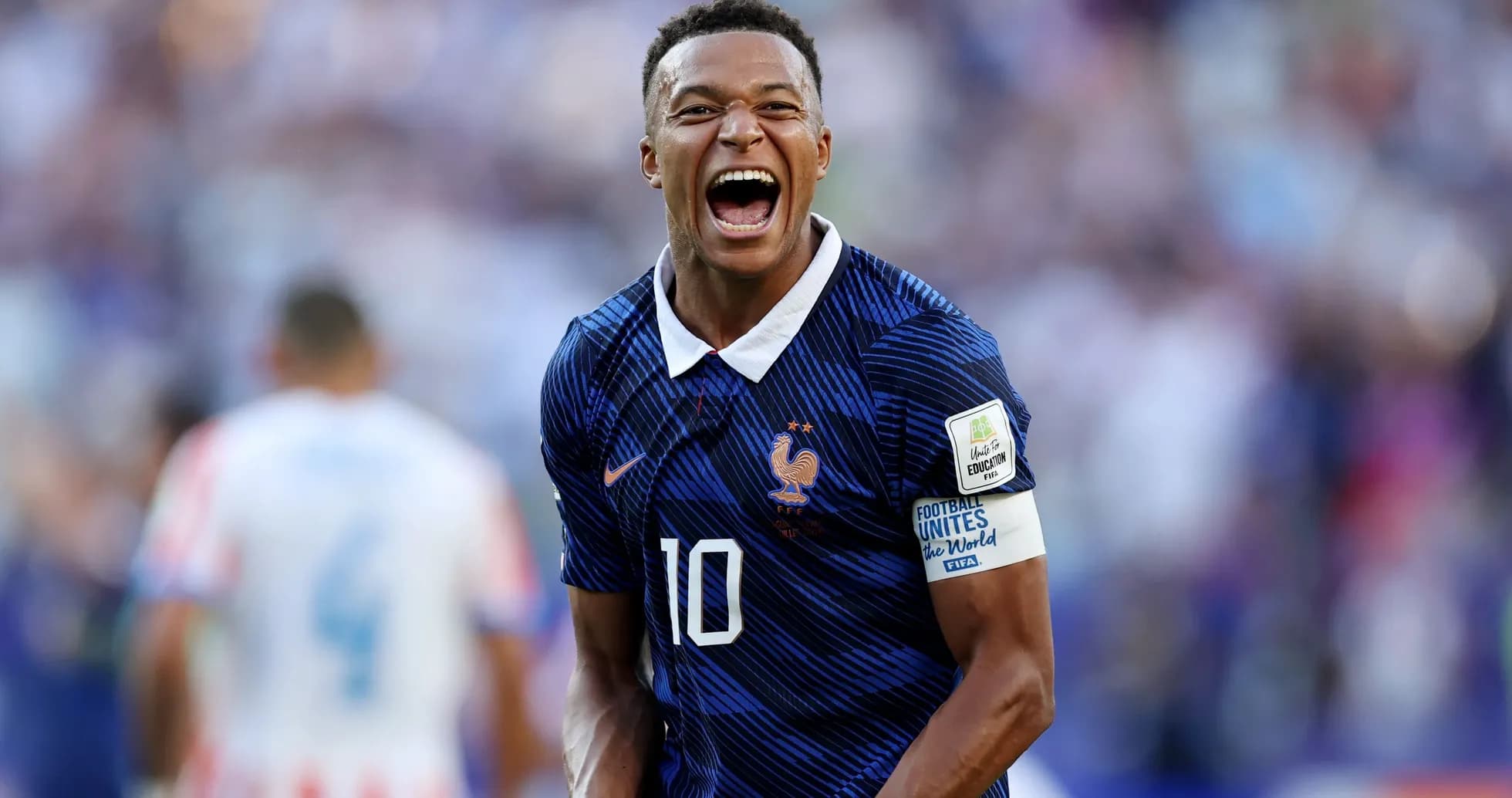 Player celebrating in France national team jersey