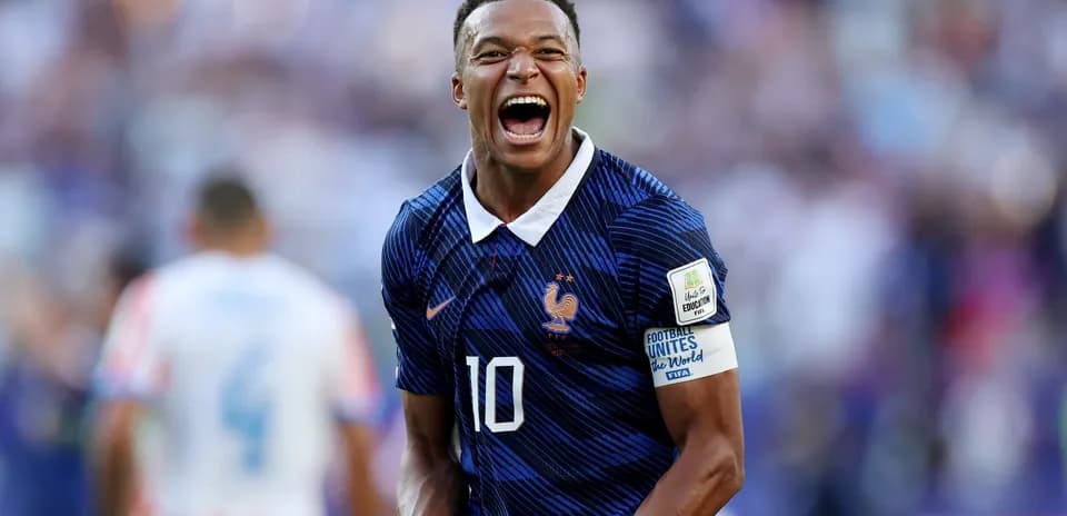 Player celebrating in France national team jersey