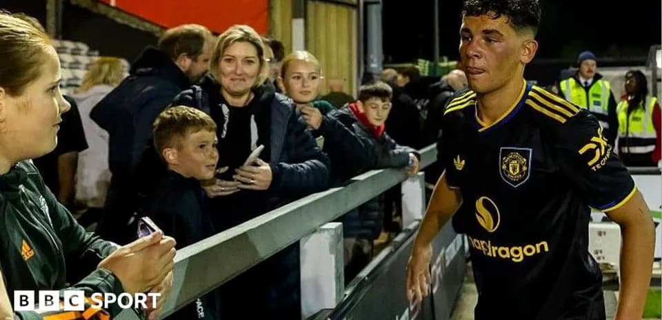 Player leaving the field with fans in background