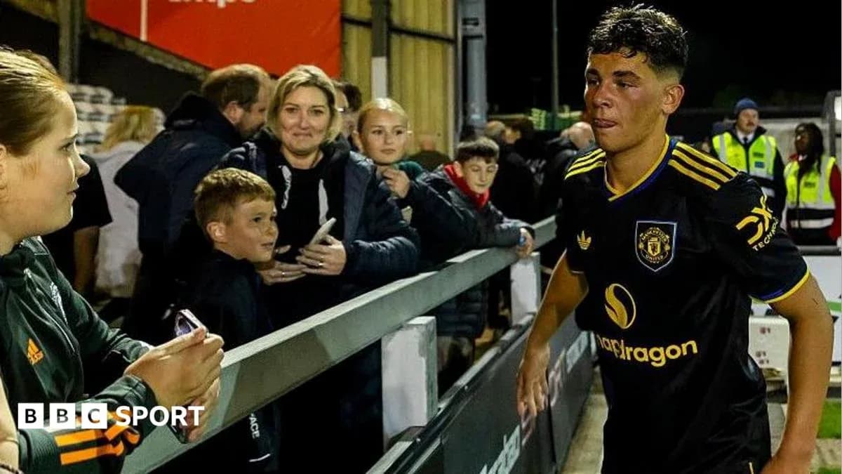 Player leaving the field with fans in background