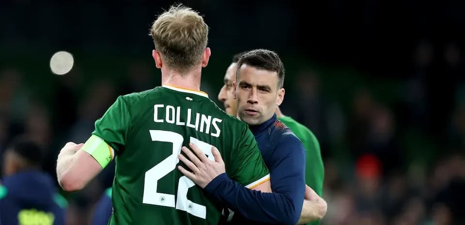 Two players embracing on the football pitch
