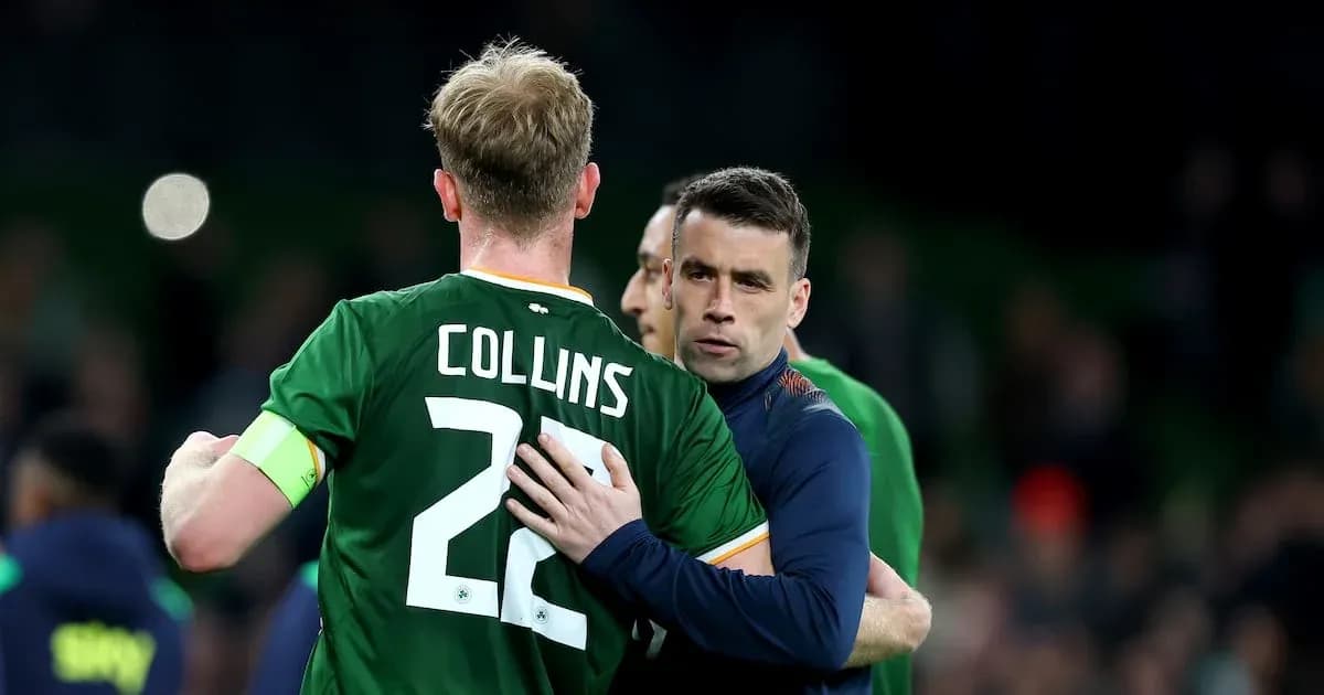 Two players embracing on the football pitch