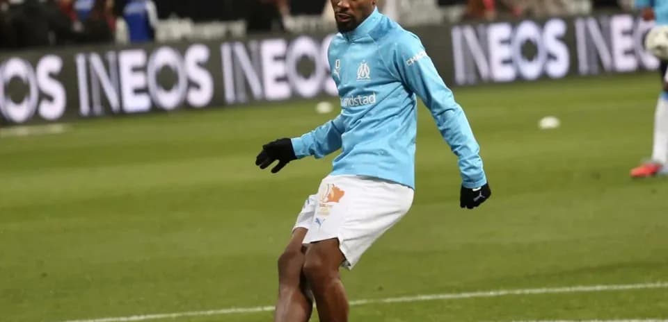 Player warming up in Marseille training kit